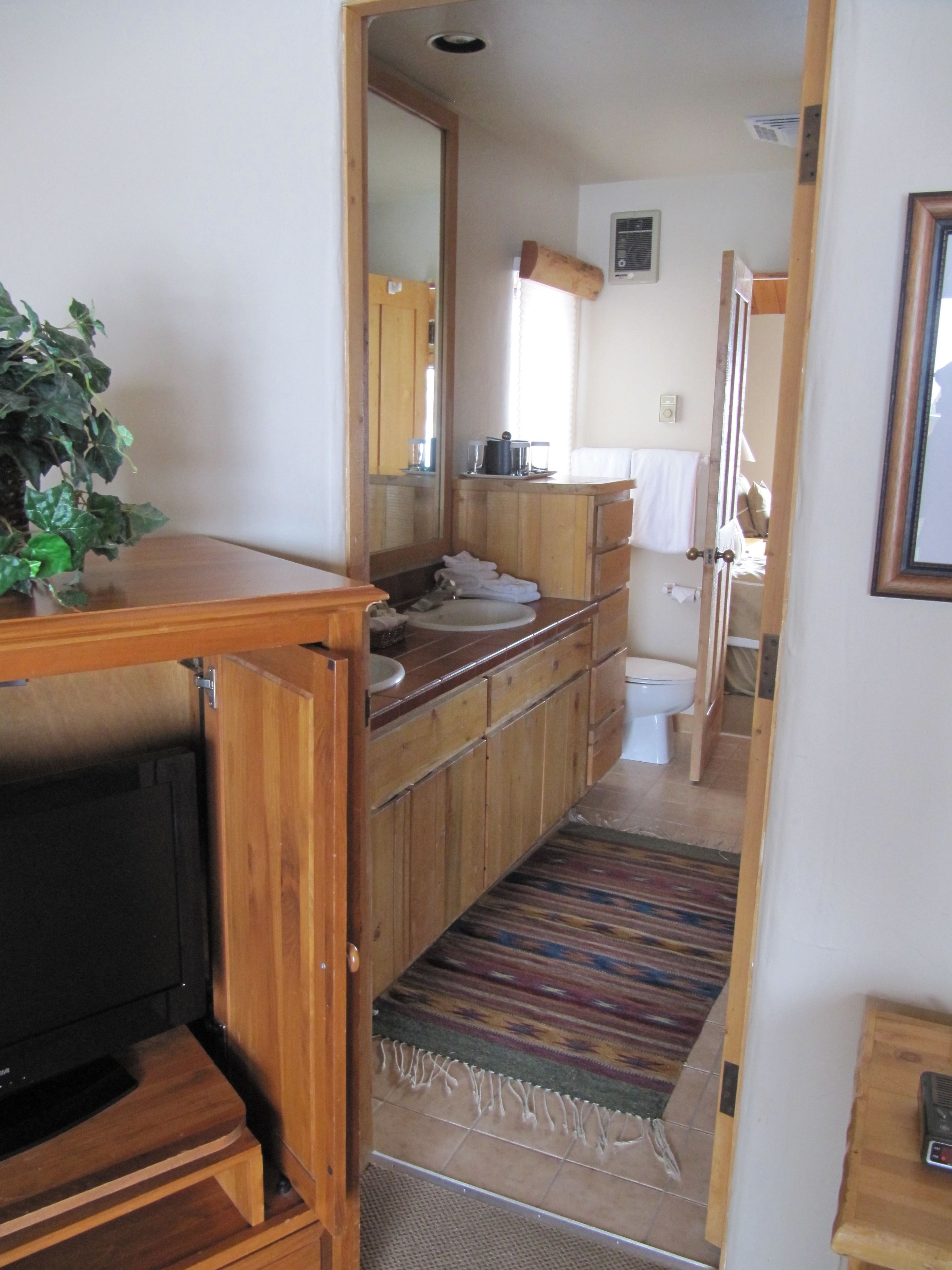 combined shower/bathtub, designer toiletries, hair dryer, bathrobes