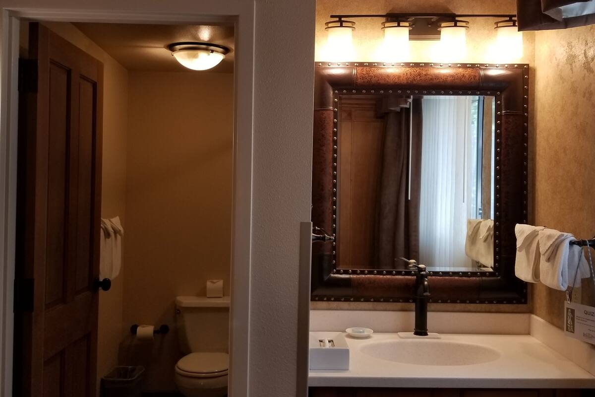 compact room, 1 queen bed, connecting rooms, courtyard area (stair access only) | bathroom | shower, rainfall showerhead, free toiletries, hair dryer