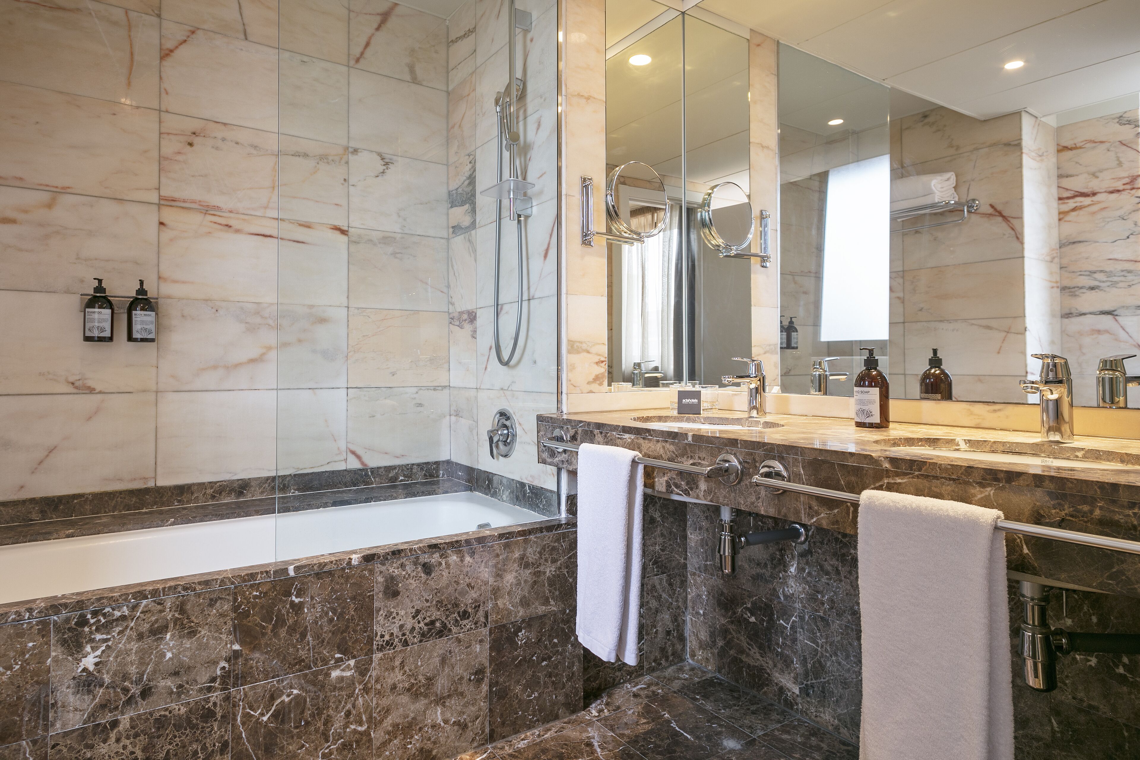 superior double room | bathroom | bathtub, free toiletries, hair dryer, slippers