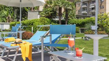 Seasonal outdoor pool, pool umbrellas, sun loungers