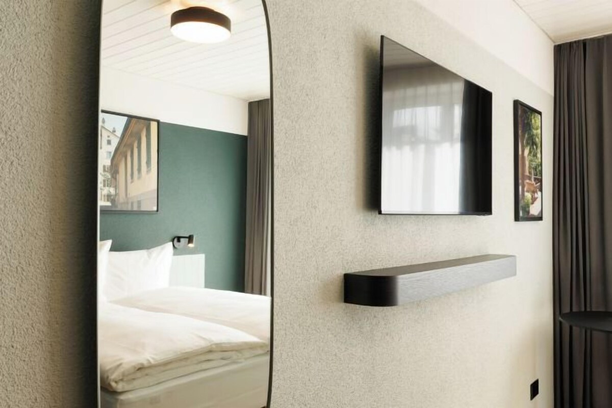 Premium bedding, down comforters, in-room safe, desk