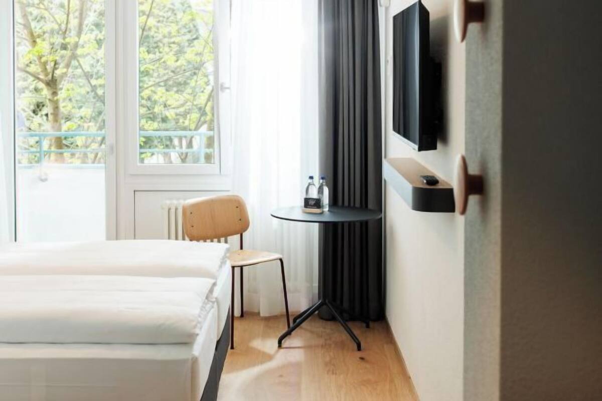 Premium bedding, down duvets, in-room safe, desk