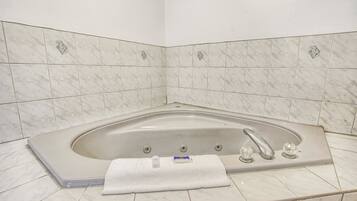 Combined shower/bathtub, hair dryer, towels, soap