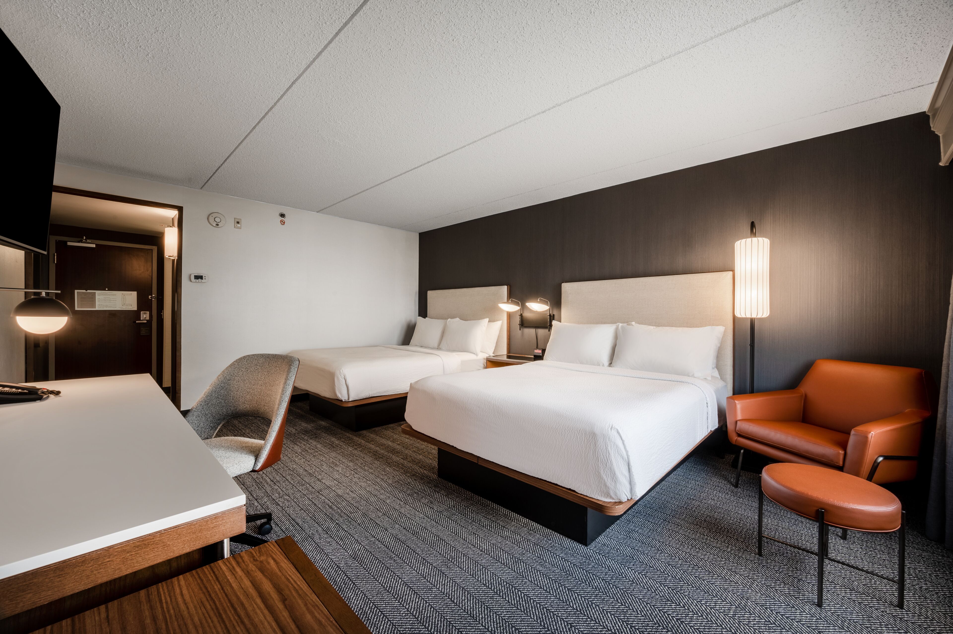 premium bedding, pillow-top beds, desk, laptop workspace