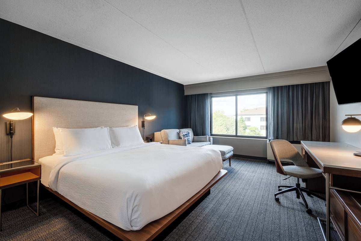 Premium bedding, pillow-top beds, desk, laptop workspace