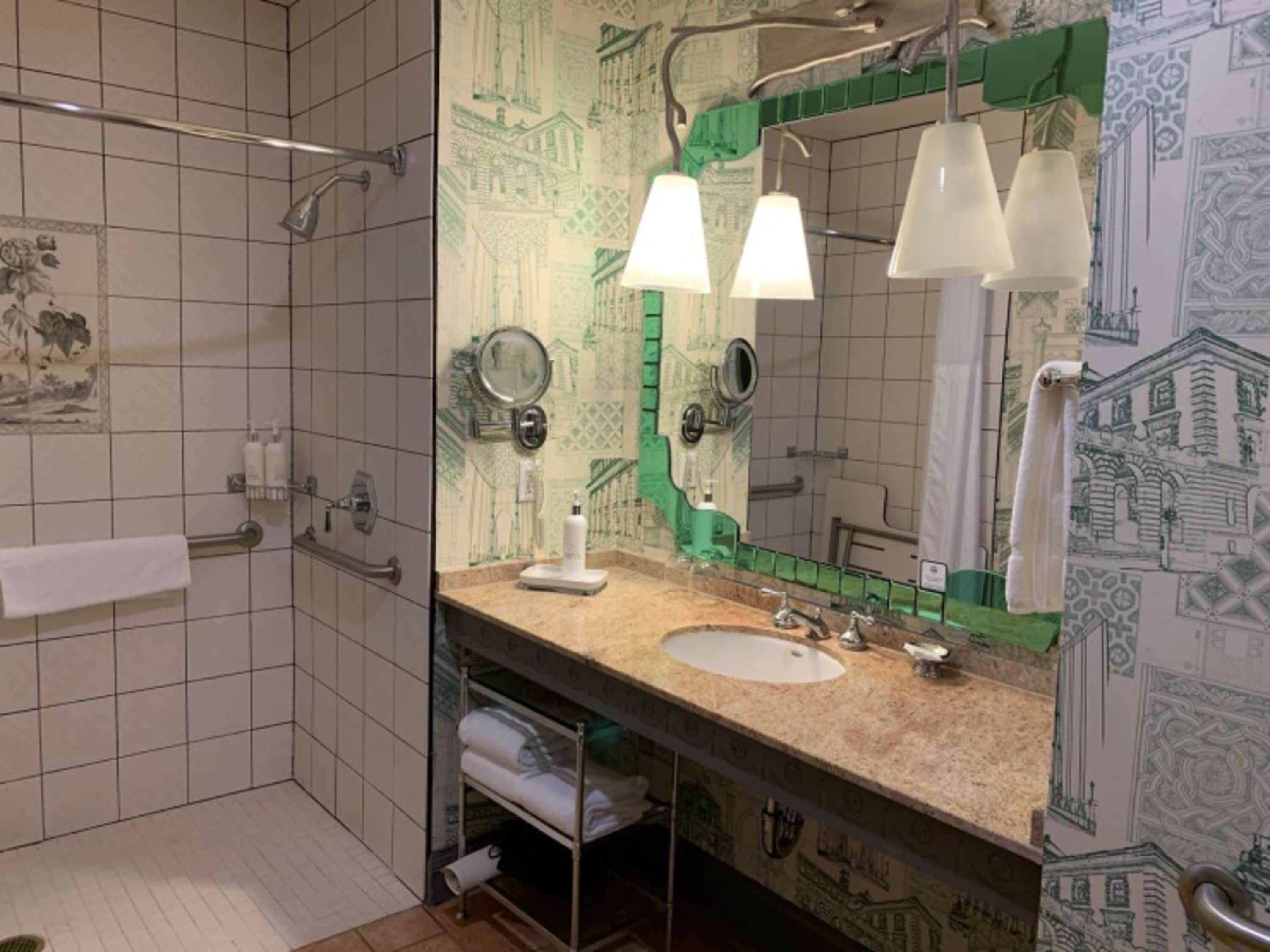 combined shower/bathtub, designer toiletries, hair dryer, bathrobes