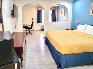 Deluxe Suite, 1 King Bed | Desk, blackout drapes, iron/ironing board, free WiFi