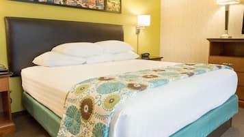 Desk, laptop workspace, blackout drapes, iron/ironing board