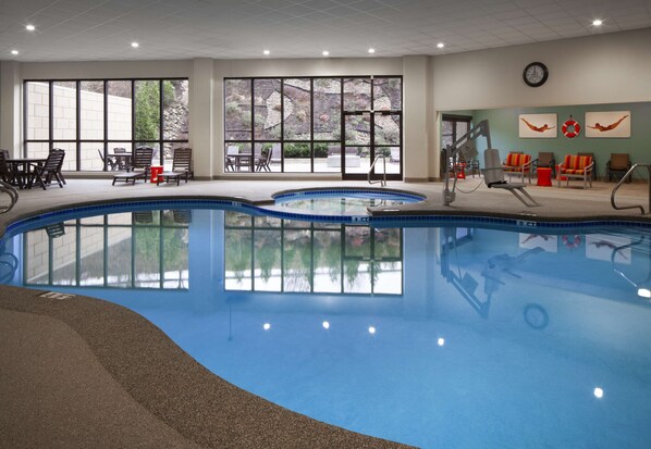 Indoor pool, open 7:00 AM to 10:00 PM, pool loungers