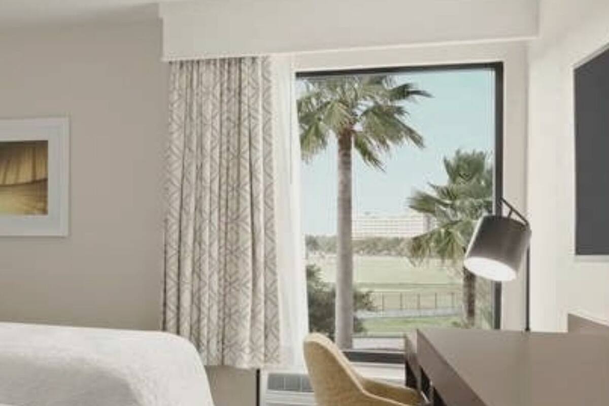 hypo-allergenic bedding, desk, laptop workspace, blackout curtains