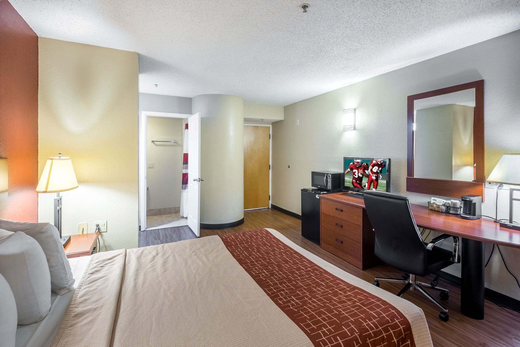 desk, laptop workspace, blackout curtains, iron/ironing board