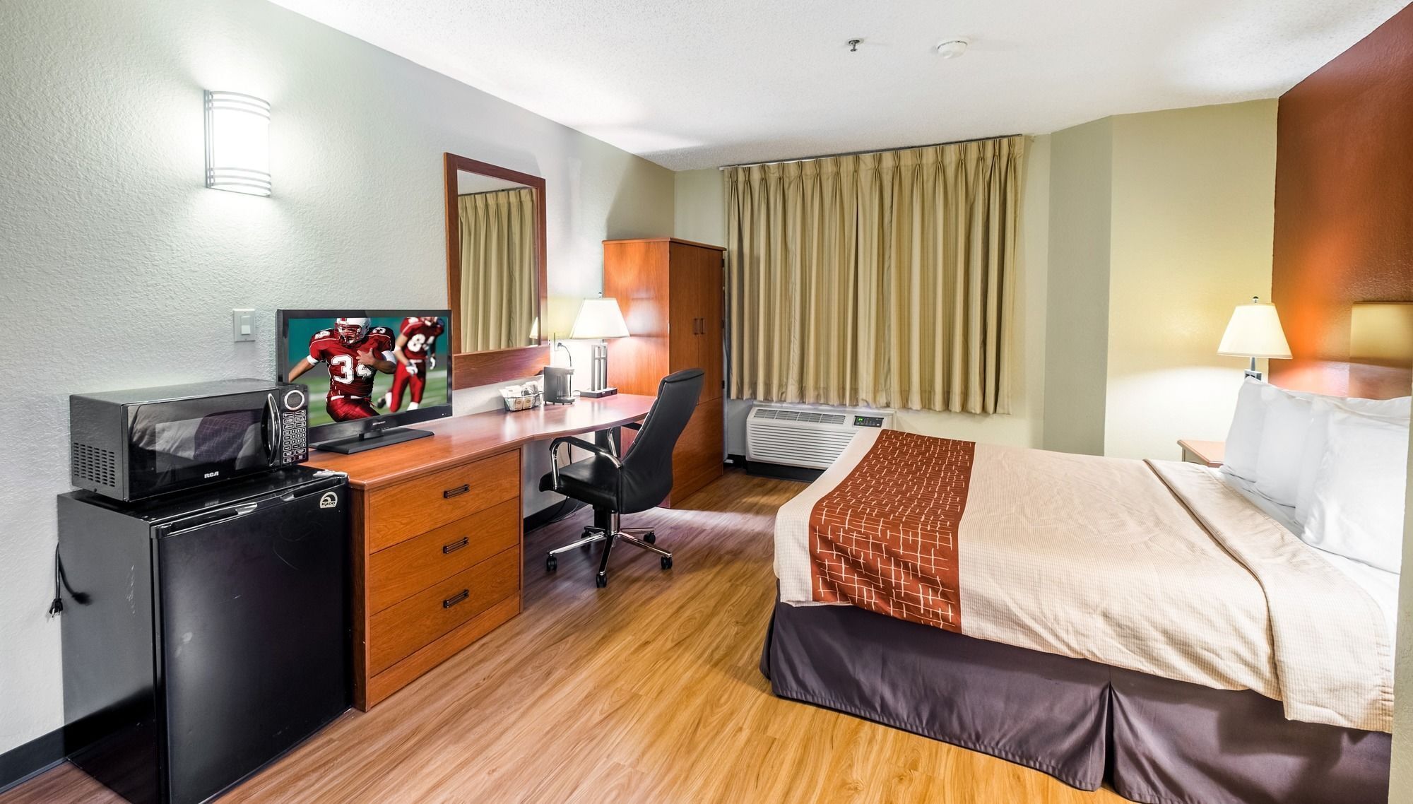 desk, laptop workspace, blackout curtains, iron/ironing board