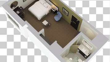 A hotel room with a bed, bedside tables, a chair, a desk, and a bathroom.