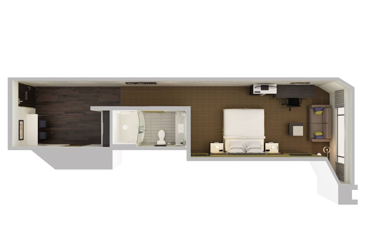 A hotel room layout with a bed, a desk, a chair, a sofa, a small table, a TV, and a bathroom.
