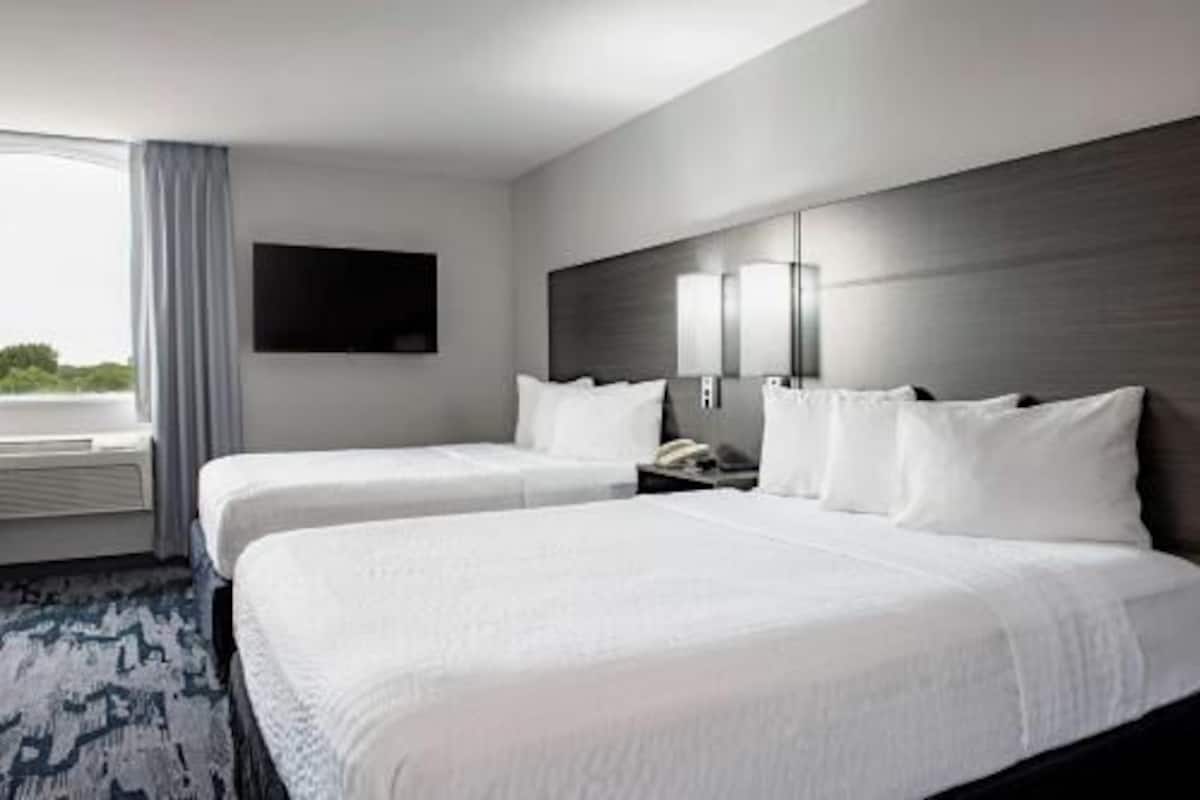 Pillow-top beds, desk, laptop workspace, blackout curtains