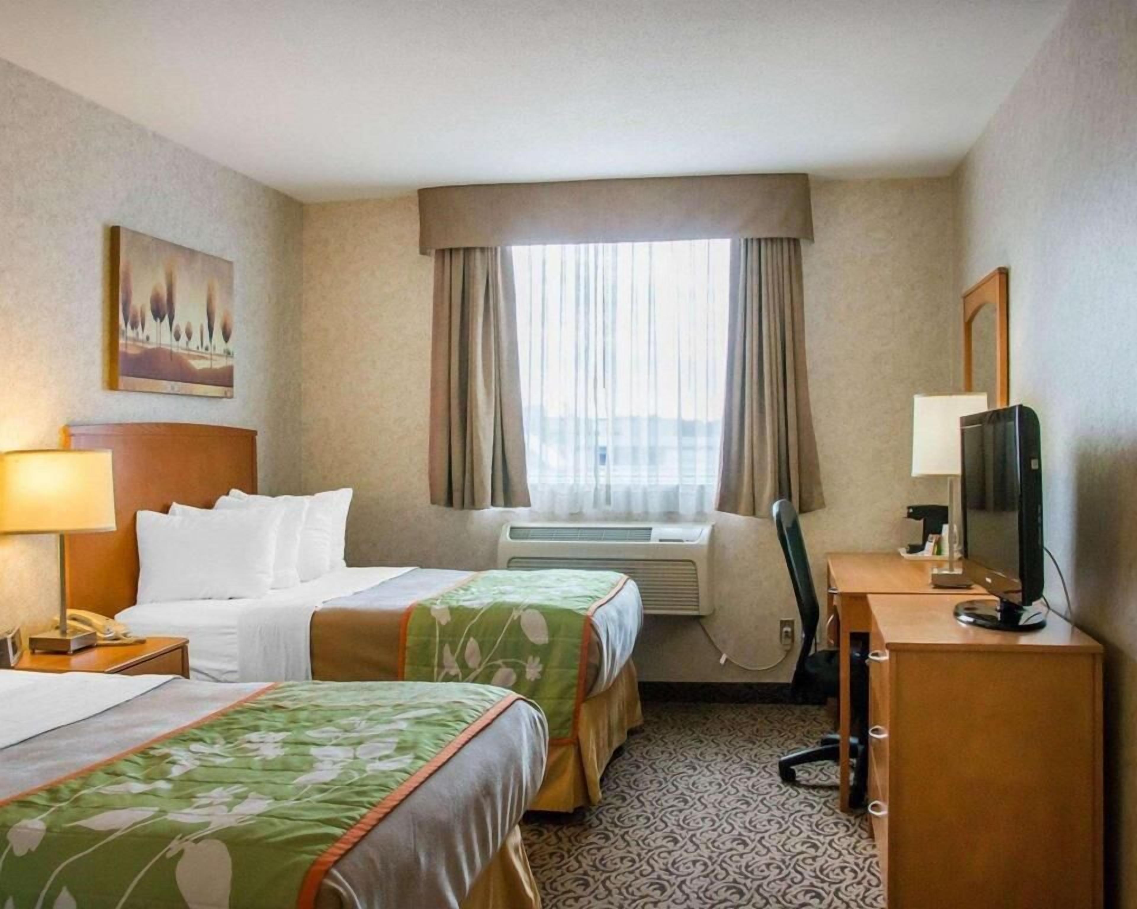 Pillowtop beds, desk, laptop workspace, blackout drapes