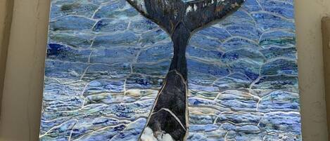A mural of a whale tail with the text "ISLAND PACKERS" above it.