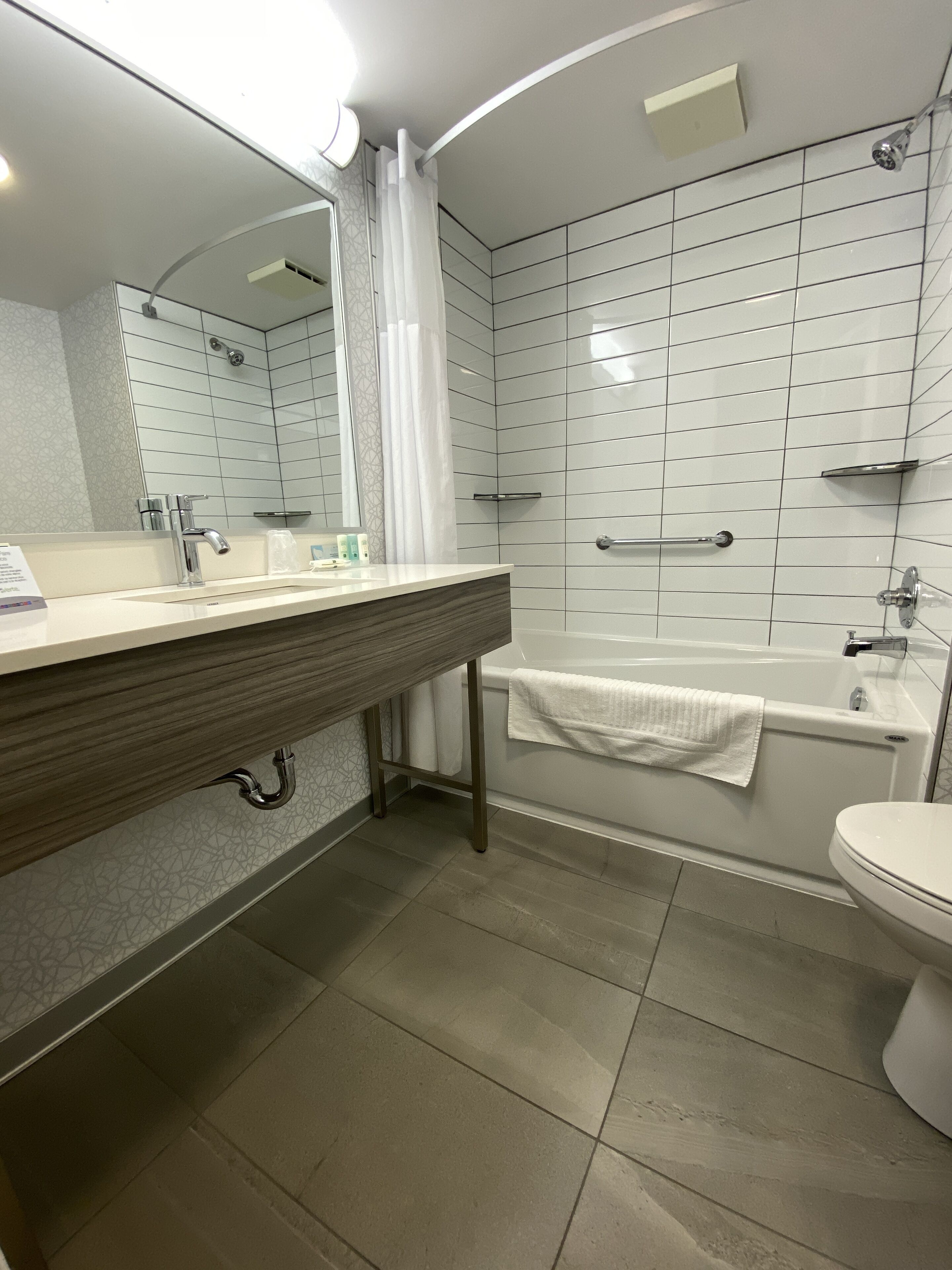 bathtub, hair dryer, towels