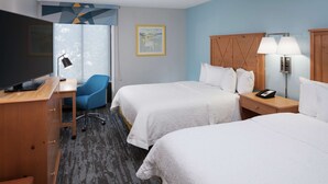 A hotel room with two beds, a desk with a computer, a chair, and a TV. - Hampton Inn Austin NW near The Domain (Austin)
