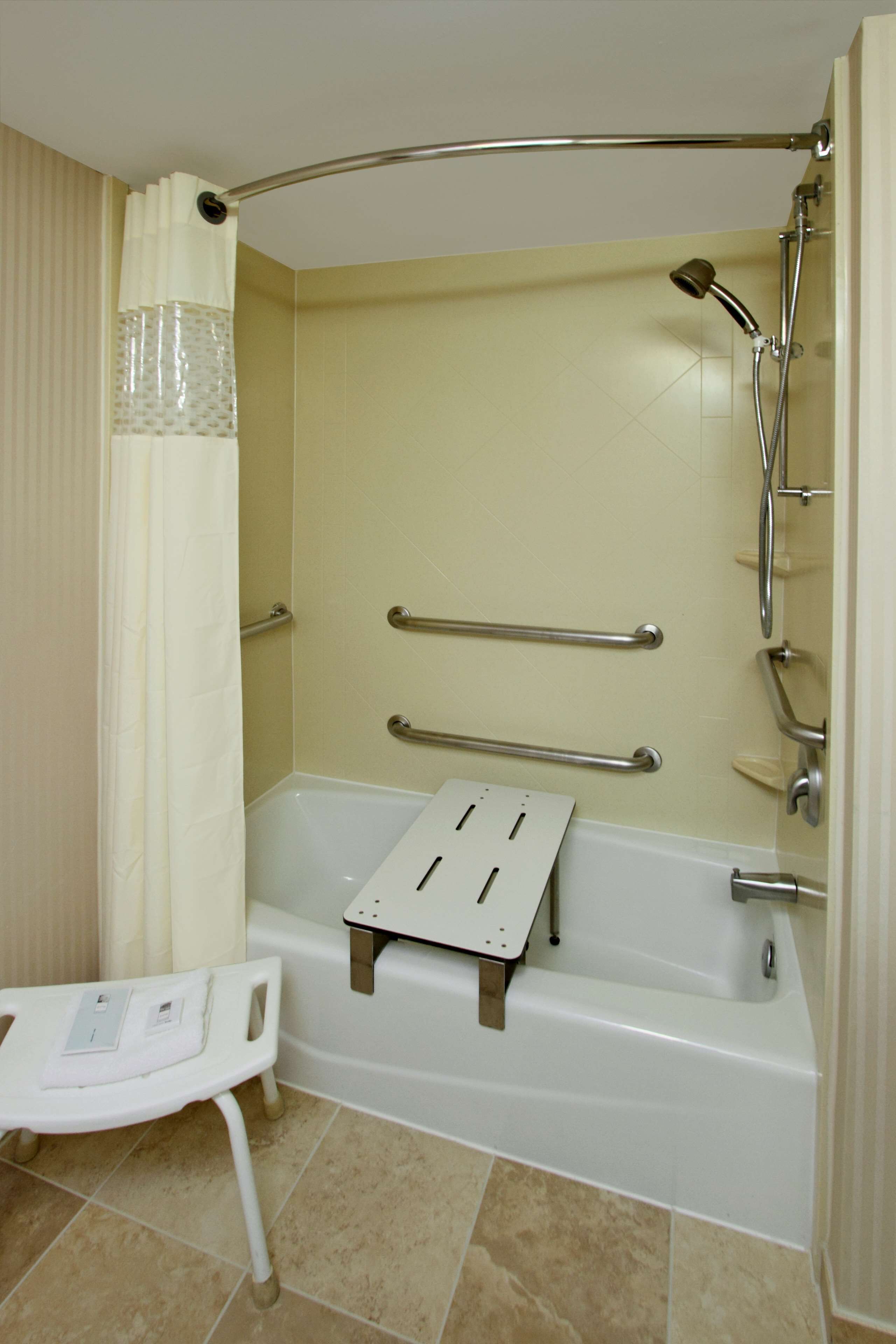 room, 1 king bed, accessible, non smoking | bathroom | combined shower/bathtub, hydromassage showerhead, designer toiletries