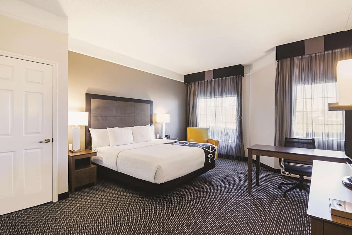 Premium bedding, pillow-top beds, desk, laptop workspace