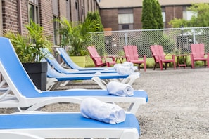 Seasonal outdoor pool, pool loungers