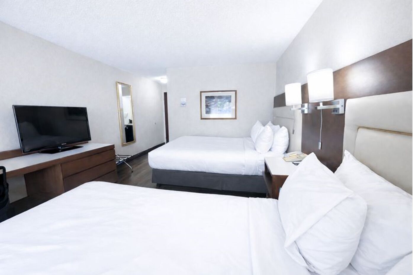 Hypo-allergenic bedding, desk, laptop workspace, blackout curtains