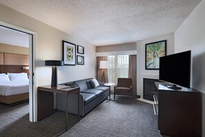 Suite, 2 Bedrooms, Fireplace | Living area | 55-inch flat-screen TV with satellite channels, TV