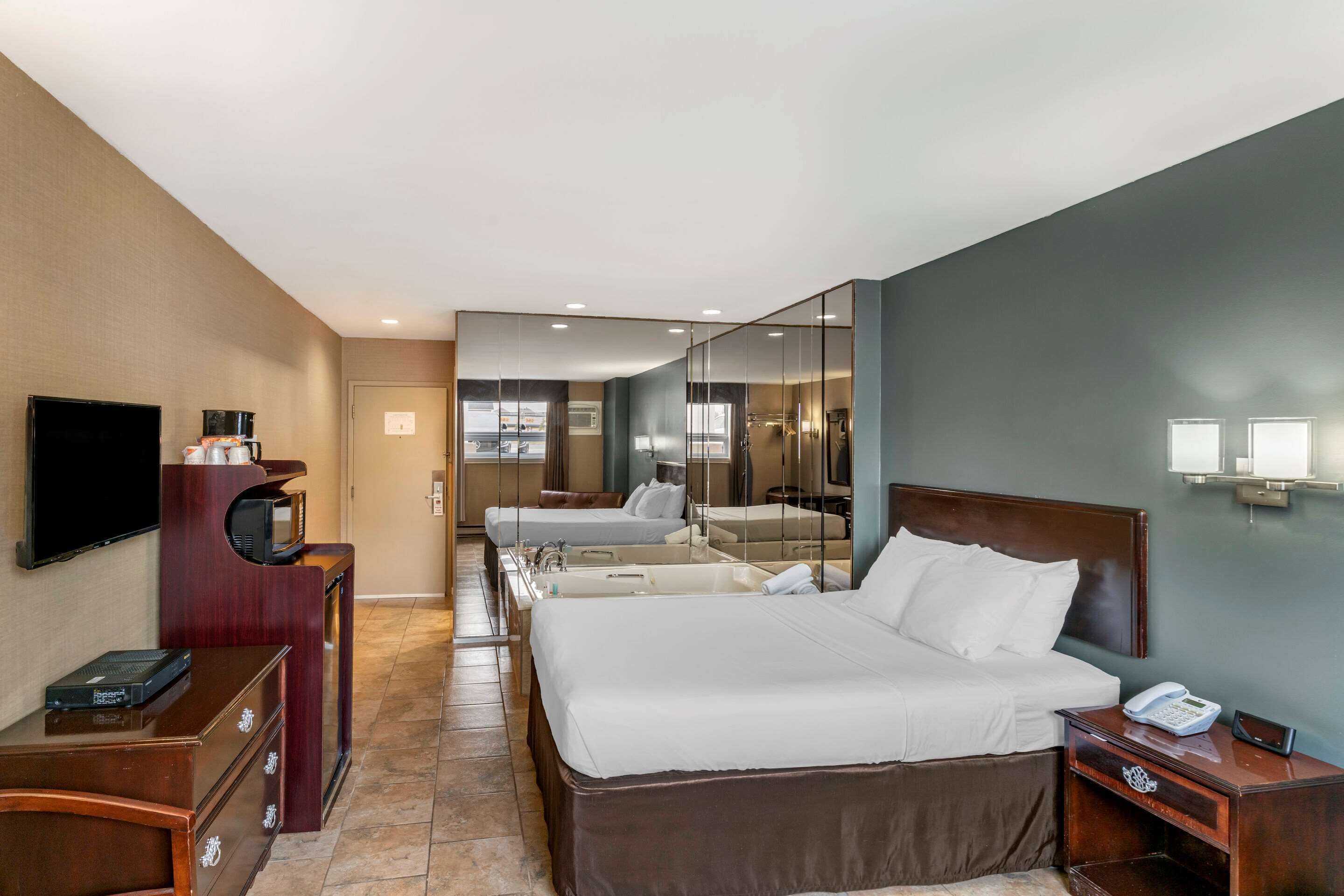 room, 2 queen beds, non smoking, jetted tub | premium bedding, desk, blackout curtains, iron/ironing board