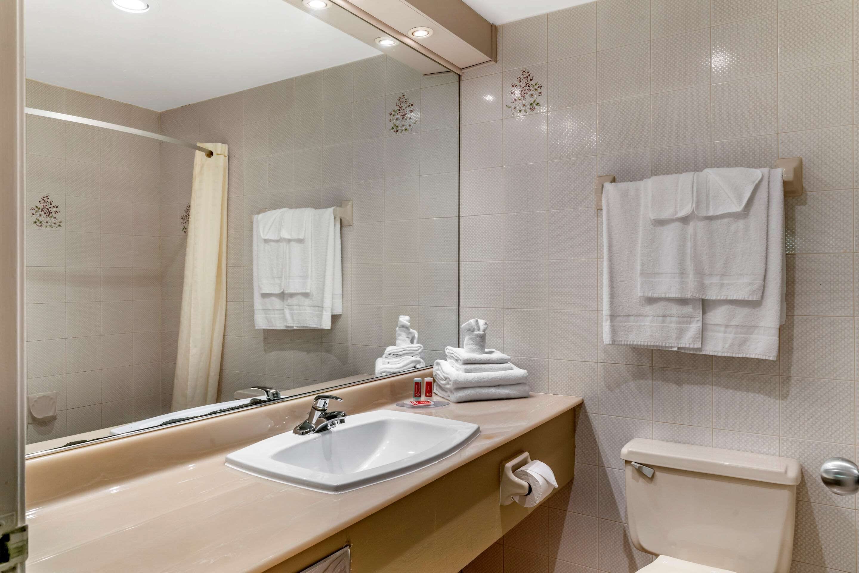 standard room, 2 queen beds, non smoking | bathroom | combined shower/bathtub, hair dryer, towels, soap