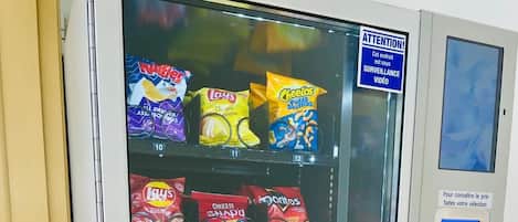 A vending machine stocked with snacks and beverages.