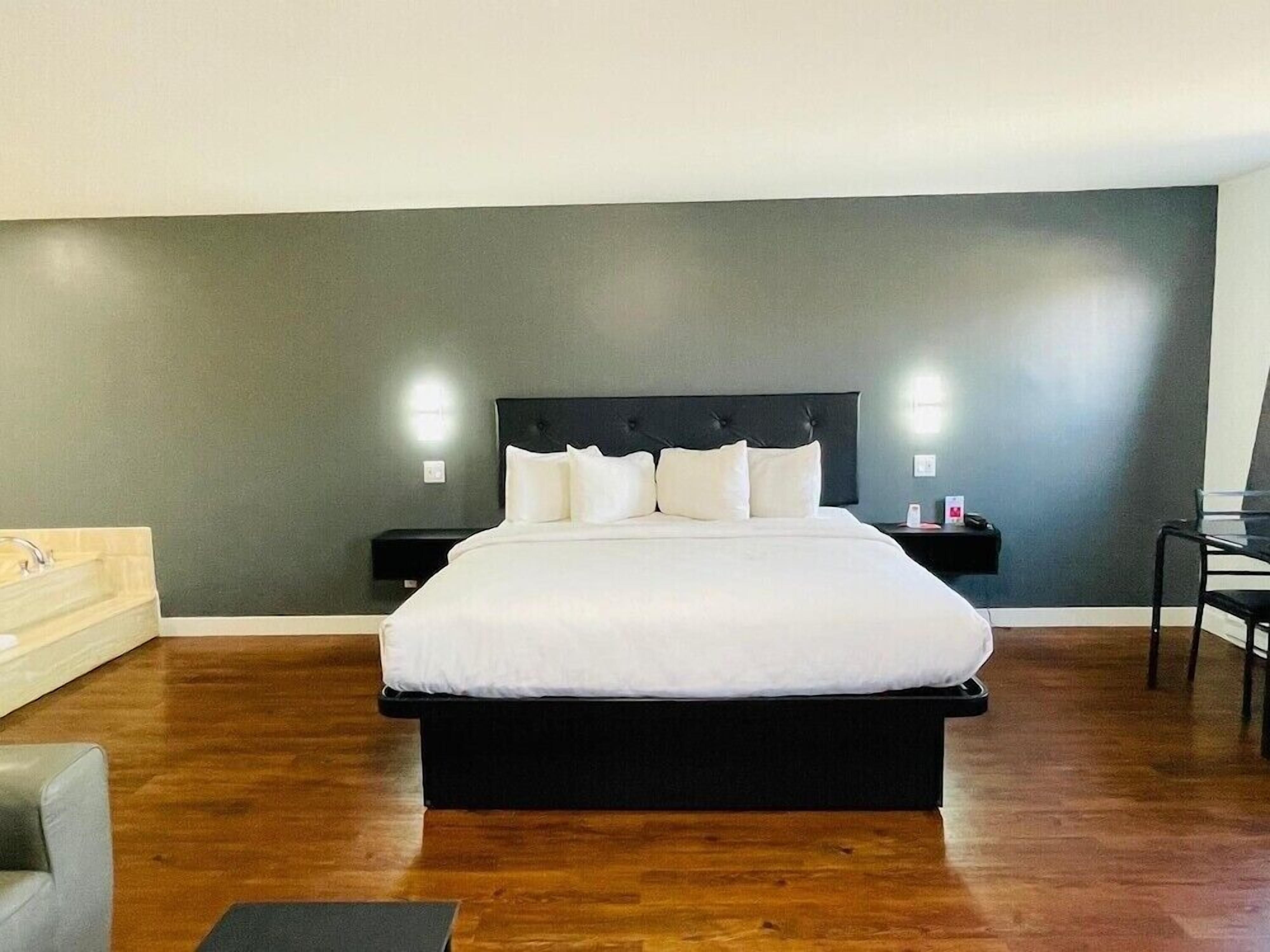 Premium bedding, Tempur-Pedic beds, desk, blackout drapes