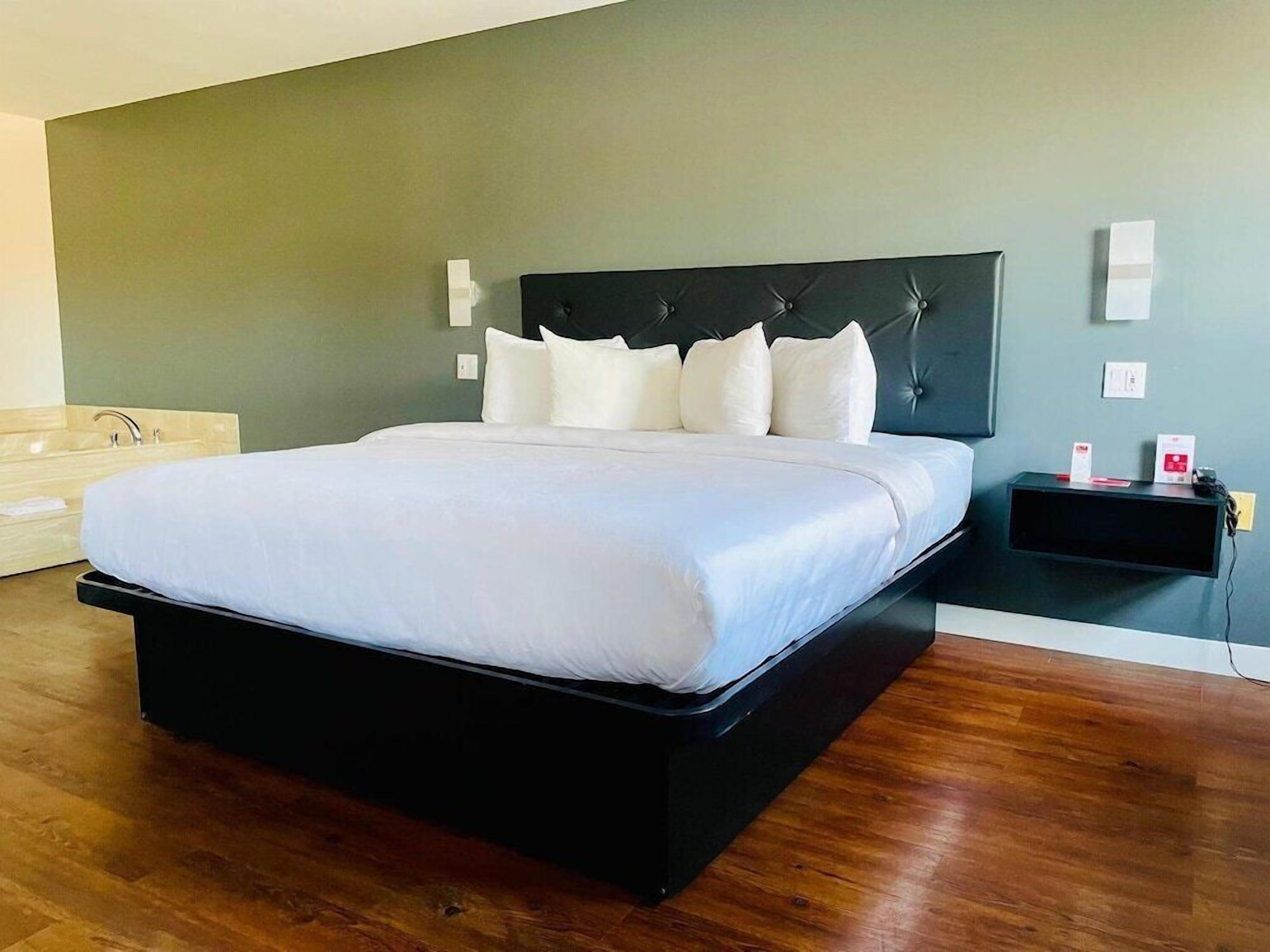 Premium bedding, Tempur-Pedic beds, desk, blackout drapes