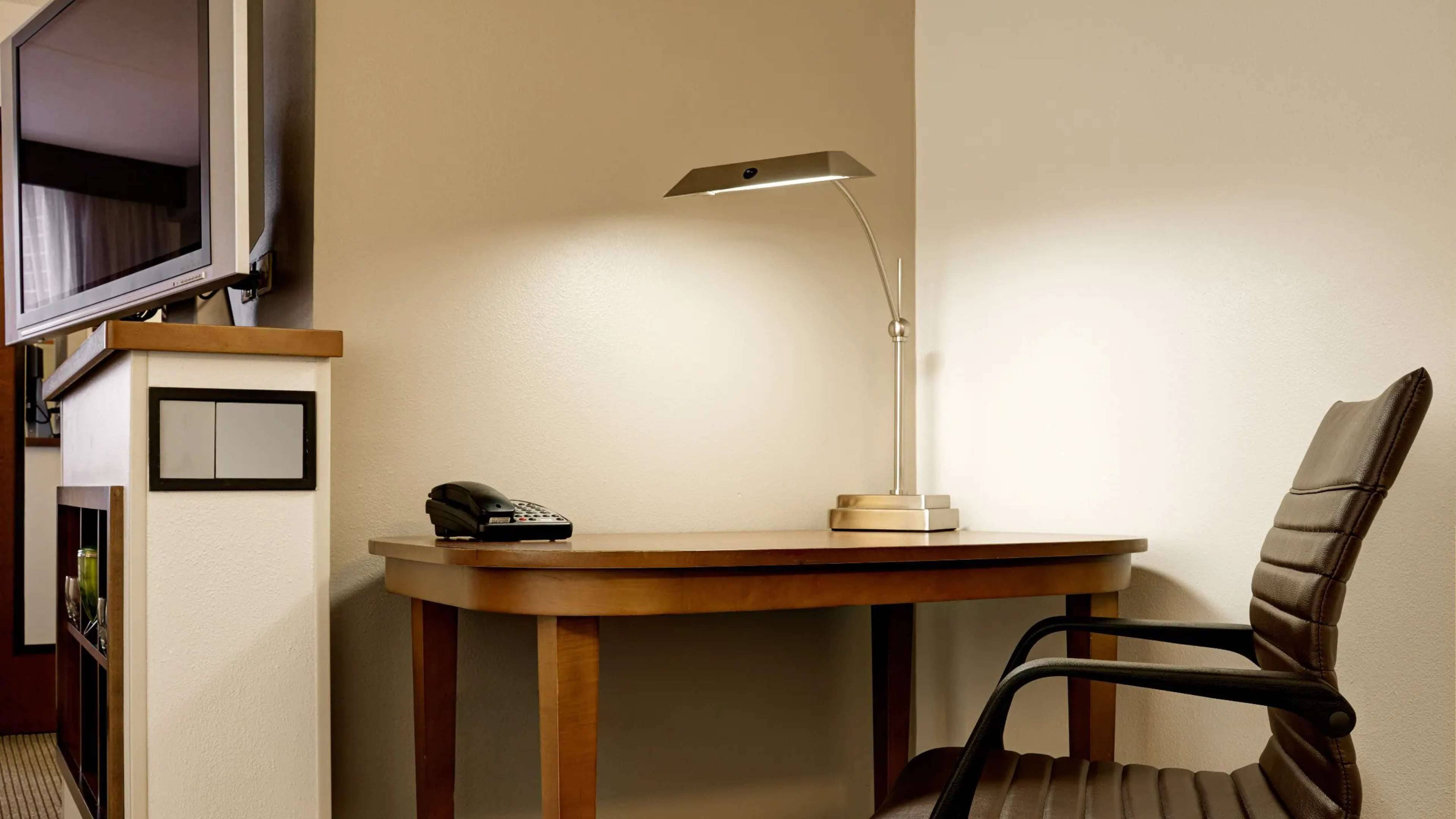 premium bedding, desk, laptop workspace, blackout curtains