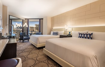 Hypo-allergenic bedding, in-room safe, desk, laptop workspace at Harrahs Hotel and Casino Las Vegas