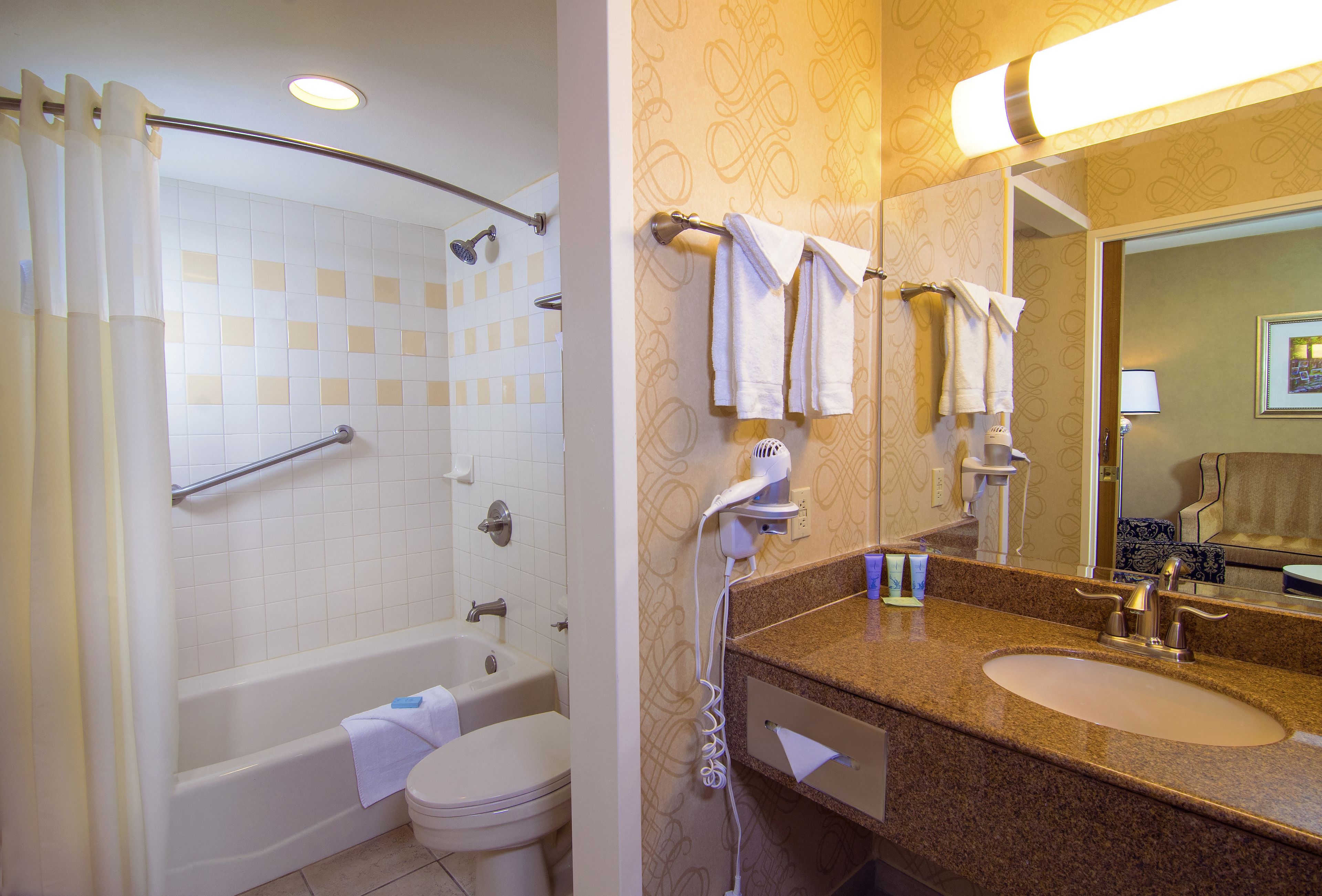 eco-friendly toiletries, hair dryer, towels