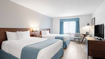 Ropa de cama de alta calidad y caja de seguridad en la habitación