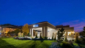 A modern building with a sign reading "First Western." - Best Western Mountainview Inn (Golden)