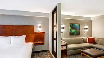 Premium bedding, desk, laptop workspace, blackout curtains