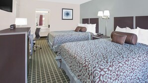 A hotel room with two beds, a desk, a chair, and a TV. - Days Inn by Wyndham Market Center Dallas Love Field (Dallas)