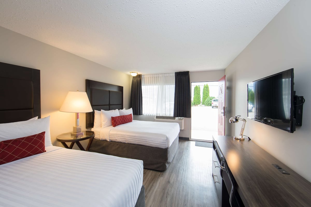 Premium bedding, Select Comfort beds, laptop workspace, blackout drapes