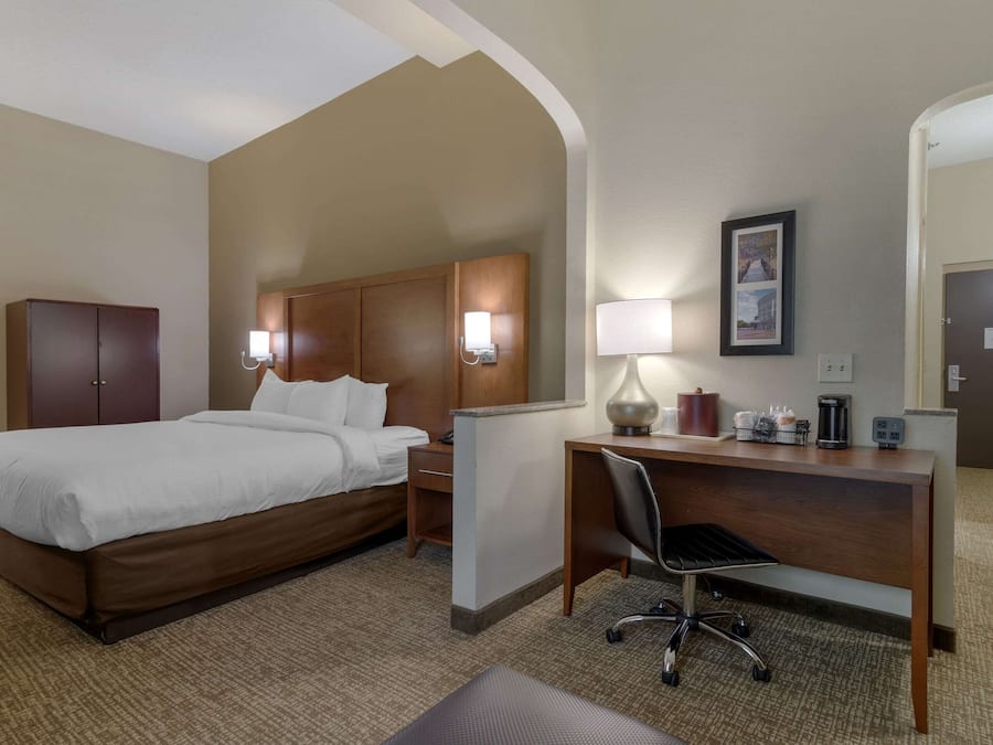 Desk, laptop workspace, blackout drapes, iron/ironing board