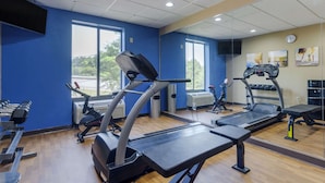 A gym with treadmills, elliptical machines, and weight benches. - Comfort Suites Columbus State University Area (Columbus)