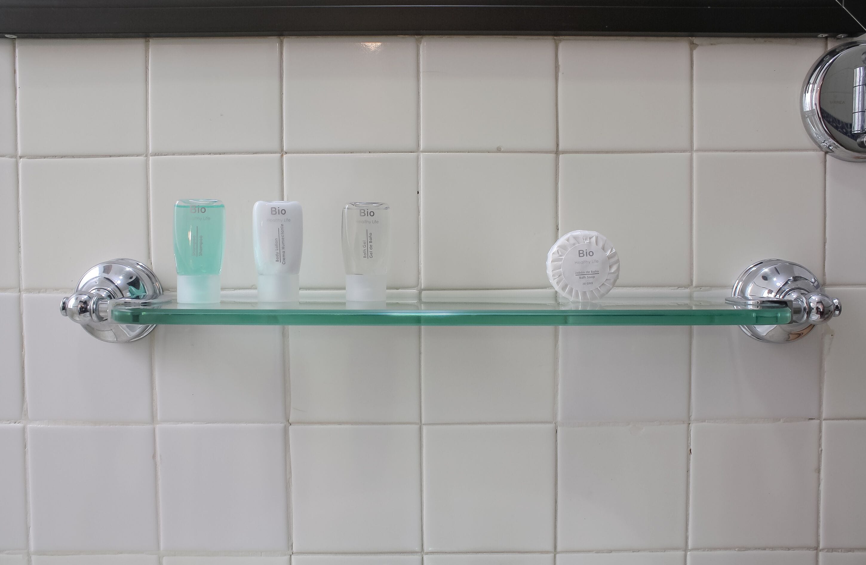 A bathroom shelf with toiletries.