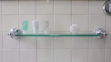 A bathroom shelf with toiletries.