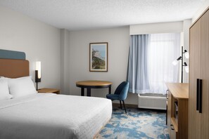 Premium bedding, pillow-top beds, desk, laptop workspace