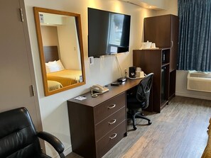 Desk, laptop workspace, blackout curtains, iron/ironing board