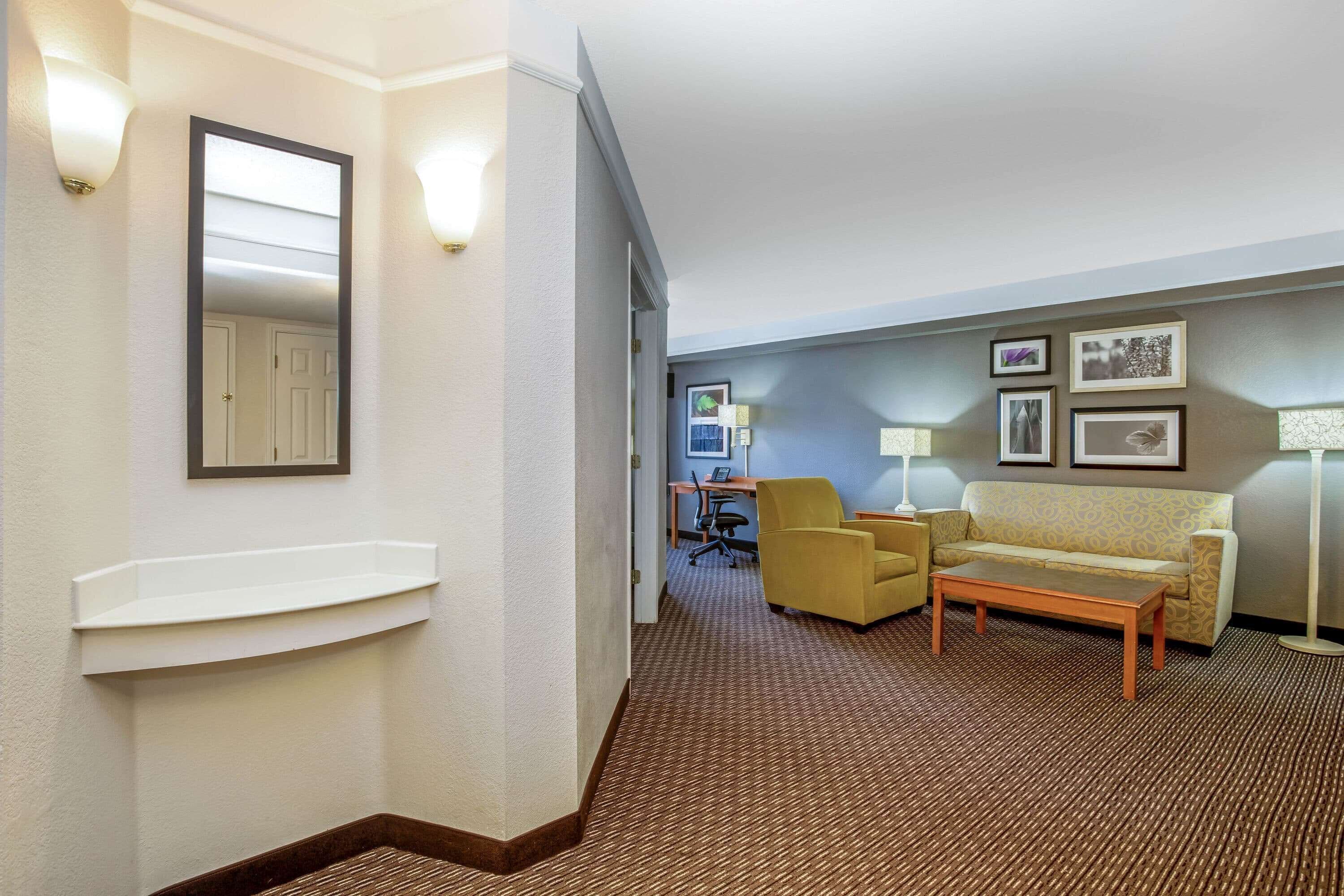 Premium bedding, desk, laptop workspace, blackout drapes