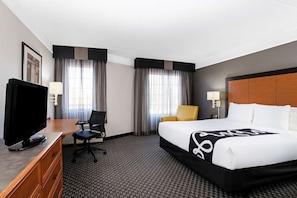 Premium bedding, desk, laptop workspace, blackout curtains