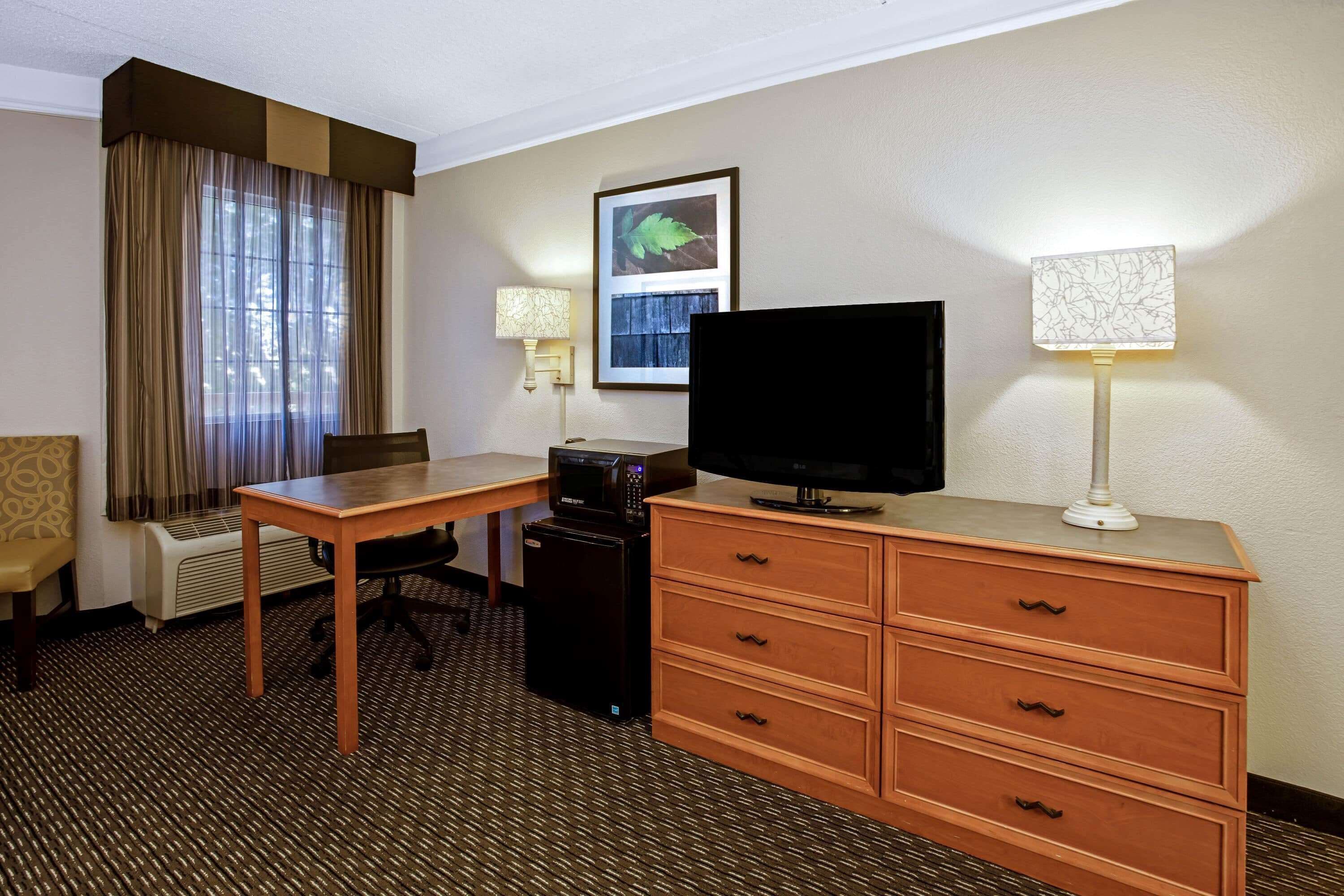 premium bedding, desk, laptop workspace, blackout curtains